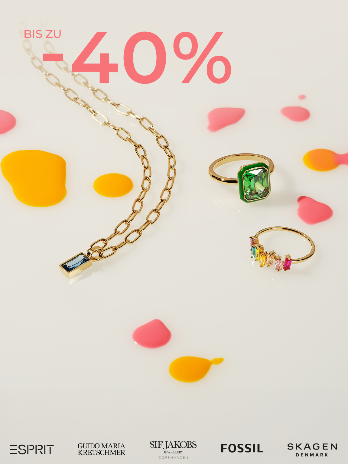 Goldkette mit blauem Anhänger und zwei Ringen mit grünen und bunten Steinen, daneben Text bis zu -40%.