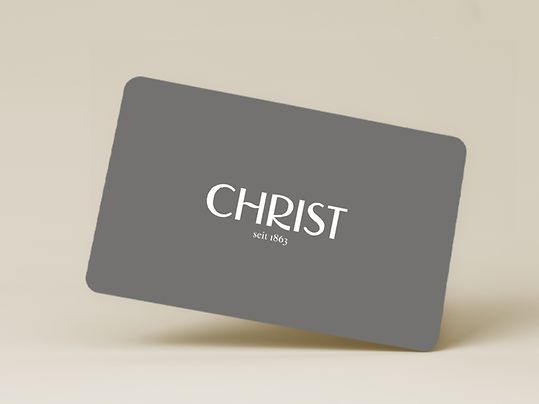 Graue Christ Gutscheinkarte auf beigem Hintergrund