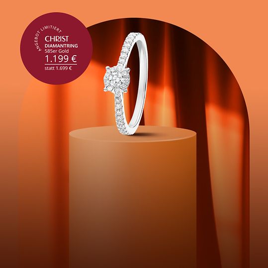 Weißgoldener Diamantring auf rundem Sockel.